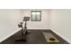 Exercise room with stationary bike, black floor and window offering a great view during workout at 1462 S Vine St, Denver, CO 80210