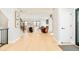 Spacious foyer with hardwood floors, modern staircase, and ample natural light at 1462 S Vine St, Denver, CO 80210