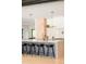 Kitchen island with barstool seating, modern pendant lighting, and sleek cabinets at 1462 S Vine St, Denver, CO 80210