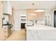 Modern kitchen features stainless appliances, marble island, pendant lights, and custom cabinetry at 1462 S Vine St, Denver, CO 80210