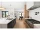 Contemporary kitchen with stainless steel appliances, center island, and a dining area in the background at 1462 S Vine St, Denver, CO 80210