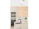 Bright kitchen boasts waterfall island, pendant lighting, and custom cabinets for a sleek, modern feel at 1462 S Vine St, Denver, CO 80210