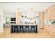 Open kitchen design with an island, bar stools, stainless steel appliances, and lots of counter space at 1462 S Vine St, Denver, CO 80210