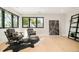 Bright living area with contemporary furniture, hardwood floors, and large windows at 1462 S Vine St, Denver, CO 80210