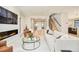 Spacious living room features a fireplace, stairs to the second floor, and hardwood floors at 1462 S Vine St, Denver, CO 80210