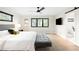 Bright main bedroom with sleek ceiling fan, large windows, television, and closet access at 1462 S Vine St, Denver, CO 80210