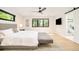 Serene main bedroom featuring a plush bed, modern decor, and natural light at 1462 S Vine St, Denver, CO 80210