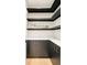 Well-organized pantry featuring black shelves, white countertops and dark cabinets with gold hardware at 1462 S Vine St, Denver, CO 80210
