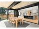 An airy patio dining area connects to a modern kitchen via sliding glass doors at 1462 S Vine St, Denver, CO 80210