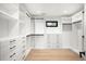 Spacious walk-in closet boasts custom shelving, drawers, and ample storage, designed for organized and luxurious living at 1462 S Vine St, Denver, CO 80210