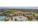 Grand community clubhouse with a pool, waterslides, and ample parking, set among well-maintained homes at 7963 S Valleyhead Way, Aurora, CO 80016