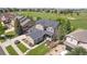 Aerial view of home in golf course community with lush green grass and scenic surroundings at 7963 S Valleyhead Way, Aurora, CO 80016