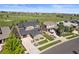 Aerial view of a beautiful home in a golf course community with lush green landscaping at 7963 S Valleyhead Way, Aurora, CO 80016
