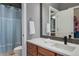 Bathroom featuring shower-tub combination, wood vanity and towel rack at 7963 S Valleyhead Way, Aurora, CO 80016