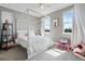 Cozy bedroom with four poster bed, carpet floors, natural light, and decor at 7963 S Valleyhead Way, Aurora, CO 80016
