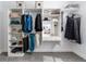 Modern closet with adjustable shelving, hanging rods, vanity, and ample storage for shoes, accessories, and clothing at 7963 S Valleyhead Way, Aurora, CO 80016