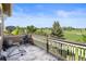 View of outdoor deck with golf course view, and exterior exercise equipment at 7963 S Valleyhead Way, Aurora, CO 80016