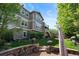 Well-maintained home exterior with beautiful landscaping and stone accents, blending into the surrounding greenery at 7963 S Valleyhead Way, Aurora, CO 80016