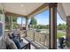 Inviting covered front porch with comfortable seating, offering a relaxing outdoor space to enjoy the neighborhood view at 7963 S Valleyhead Way, Aurora, CO 80016