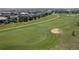 Scenic view of the golf course with manicured greens and distant residential area under a blue sky at 7963 S Valleyhead Way, Aurora, CO 80016
