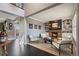 Spacious living room boasts a stone fireplace, built-in shelving, and modern decor at 7963 S Valleyhead Way, Aurora, CO 80016