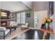 Inviting living room with stone fireplace, built-in shelving, and lots of natural light at 7963 S Valleyhead Way, Aurora, CO 80016