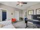Bright office with modern desk, gray walls, and two chairs at 7963 S Valleyhead Way, Aurora, CO 80016