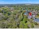 Scenic aerial view showcases property's location near lush green spaces, walking paths, and ponds at 20460 Oakbrook Ln, Parker, CO 80138
