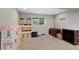 Finished basement with an organized shelving unit and a doll house at 20460 Oakbrook Ln, Parker, CO 80138