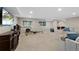 Spacious finished basement with neutral carpet, recessed lights, and a workout area at 20460 Oakbrook Ln, Parker, CO 80138