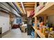 Unfinished basement with concrete floors and exposed ceiling, providing ample storage space at 20460 Oakbrook Ln, Parker, CO 80138