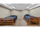 Finished basement bedroom with two twin beds, neutral carpet and recessed lights at 20460 Oakbrook Ln, Parker, CO 80138