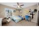 Cozy bedroom featuring a comfortable chair, natural light, and creative wall decor at 20460 Oakbrook Ln, Parker, CO 80138