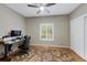 Bedroom featuring hardwood floors, ceiling fan, shuttered window, and a closet at 20460 Oakbrook Ln, Parker, CO 80138
