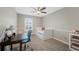 Bright bedroom with a comfortable bed, hardwood floors, and a desk at 20460 Oakbrook Ln, Parker, CO 80138