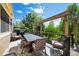 Outdoor deck features dining and seating with a lush treeline view, perfect for entertaining at 20460 Oakbrook Ln, Parker, CO 80138