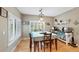 Bright dining room with hardwood floors, stylish light fixture, and coffee bar at 20460 Oakbrook Ln, Parker, CO 80138