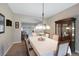 Charming dining area with a table set for six, chandelier lighting, and neutral paint at 20460 Oakbrook Ln, Parker, CO 80138