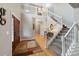 Grand entryway featuring a staircase with white railings, chandelier, and a view of the upper level at 20460 Oakbrook Ln, Parker, CO 80138