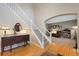 Elegant entryway showcasing hardwood floors, stairs, and decoratively furnished with tasteful accents at 20460 Oakbrook Ln, Parker, CO 80138