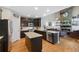 Open concept kitchen with hardwood floors, granite countertops, and stainless steel appliances at 20460 Oakbrook Ln, Parker, CO 80138