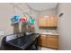 This laundry room has modern machines, storage shelves and cabinets, with a utility sink at 20460 Oakbrook Ln, Parker, CO 80138