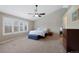Spacious main bedroom with vaulted ceiling, ample natural light, and neutral carpet at 20460 Oakbrook Ln, Parker, CO 80138