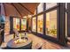 Outdoor deck with fire pit and partial view of the interior at 5090 S Perry Park, Sedalia, CO 80135