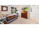 Well-lit bedroom featuring a daybed, a secretary desk, and a television at 5090 S Perry Park, Sedalia, CO 80135