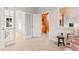 Bright hallway featuring an open door, and glimpse of a spiral staircase at 5090 S Perry Park, Sedalia, CO 80135