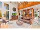 Inviting living room with a large wooden staircase, a comfortable sofa, and elegant decor at 5090 S Perry Park, Sedalia, CO 80135