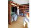 Well-organized walk-in closet featuring custom wood shelving and rod storage at 5090 S Perry Park, Sedalia, CO 80135