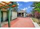 Fully fenced backyard featuring a brick patio and outdoor kitchen at 1669 S Uvalda St, Aurora, CO 80012