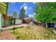 View of the backyard, patio, and exterior of the buildings at 1669 S Uvalda St, Aurora, CO 80012